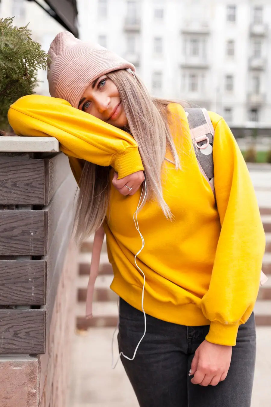 smiling woman with beanieposing 23 2148382782